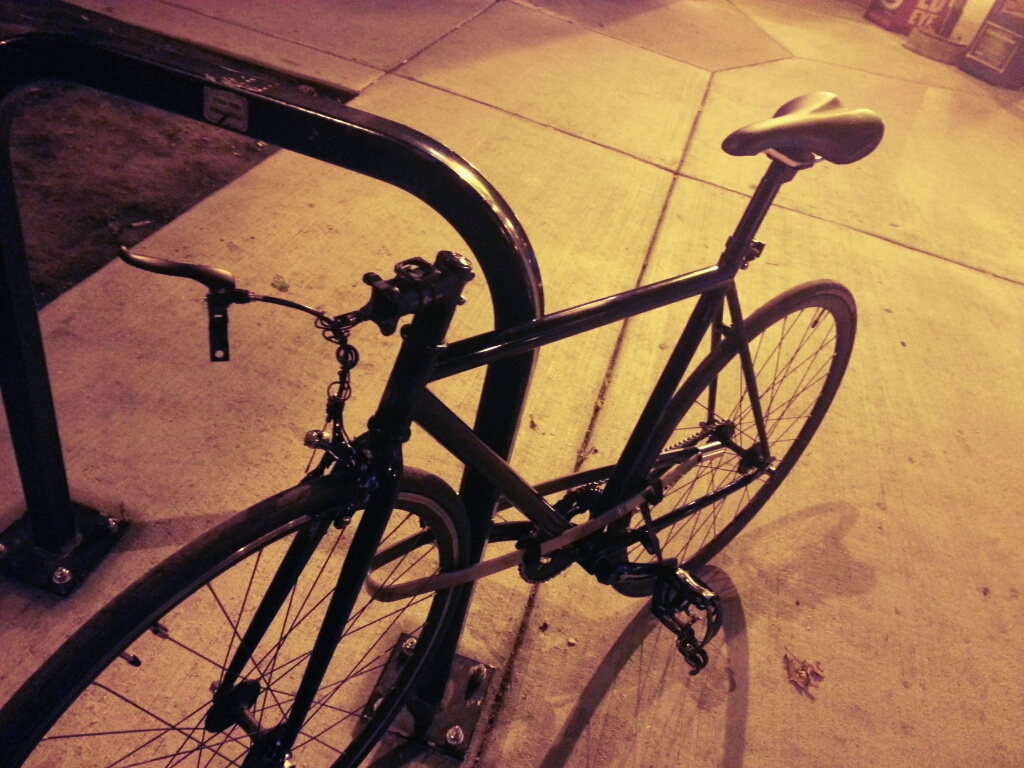 Unmarked black fixie (handlebars stolen)