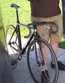Black flat frame with white "MOTH" on side with front disc break