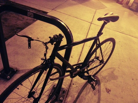Unmarked black fixie (handlebars stolen)